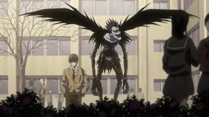 Light Yagami walking in his schoolyard with the Shinigami Ryuk floating behind him in the Death Note anime.