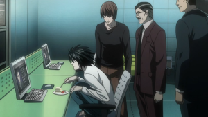 The detective L crouching characteristically on a chair while eating dessert and working with Light Yagami and the Kira task force in Death Note