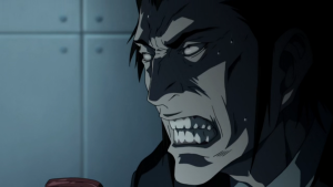 An intense close-up of a character's face contorted in anger or madness from the Death Note anime.