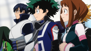 Close-up of Izuku Midoriya, Tenya Iida, and Ochaco Uraraka in their U.A. gym uniforms looking serious in My Hero Academia.